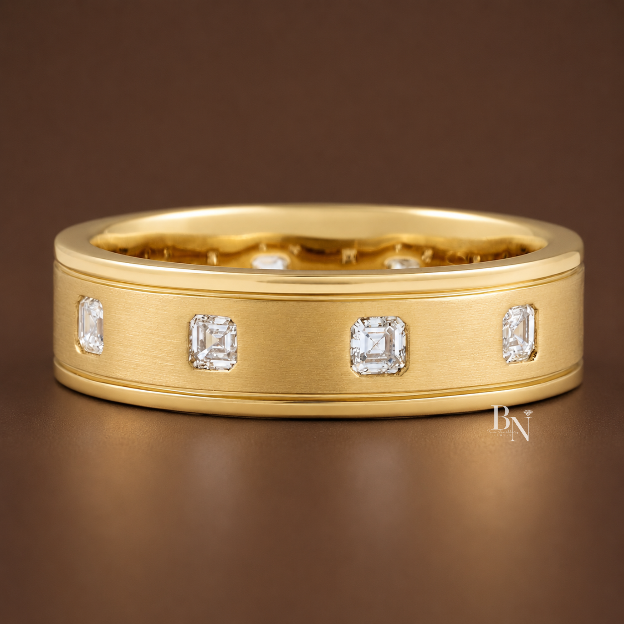 Asscher cut lab diamond eternity band with matte gold finish, bezel set stones, wide 6.1mm band, modern minimalist wedding ring, fine jewelry.