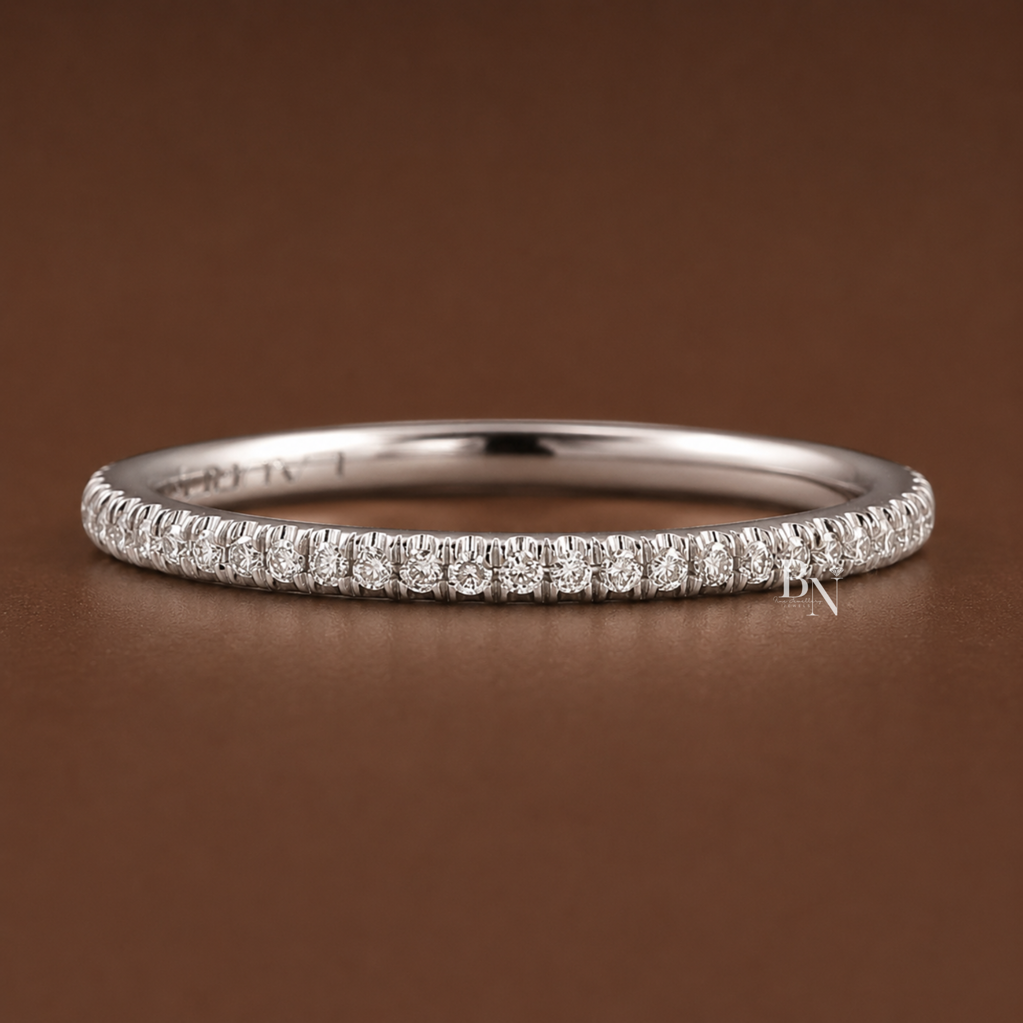 Super slim 1.5mm eternity band handcrafted in 14k gold, featuring a delicate row of round brilliant lab grown diamonds, perfect for elegant bridal stacking.