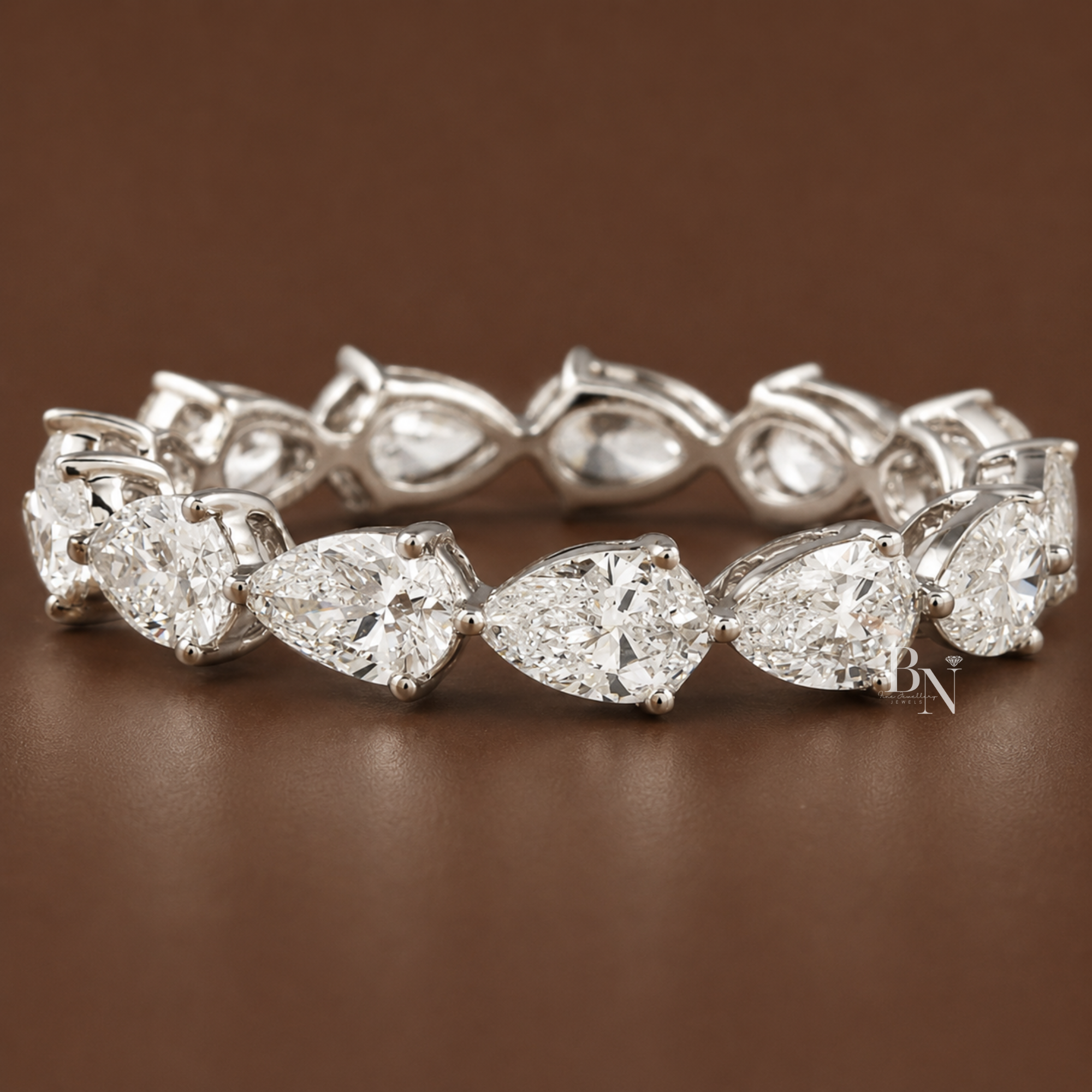 East-west pear cut lab diamond full eternity band in 14k gold with a sophisticated shared prong setting, perfect for luxury bridal stacking.