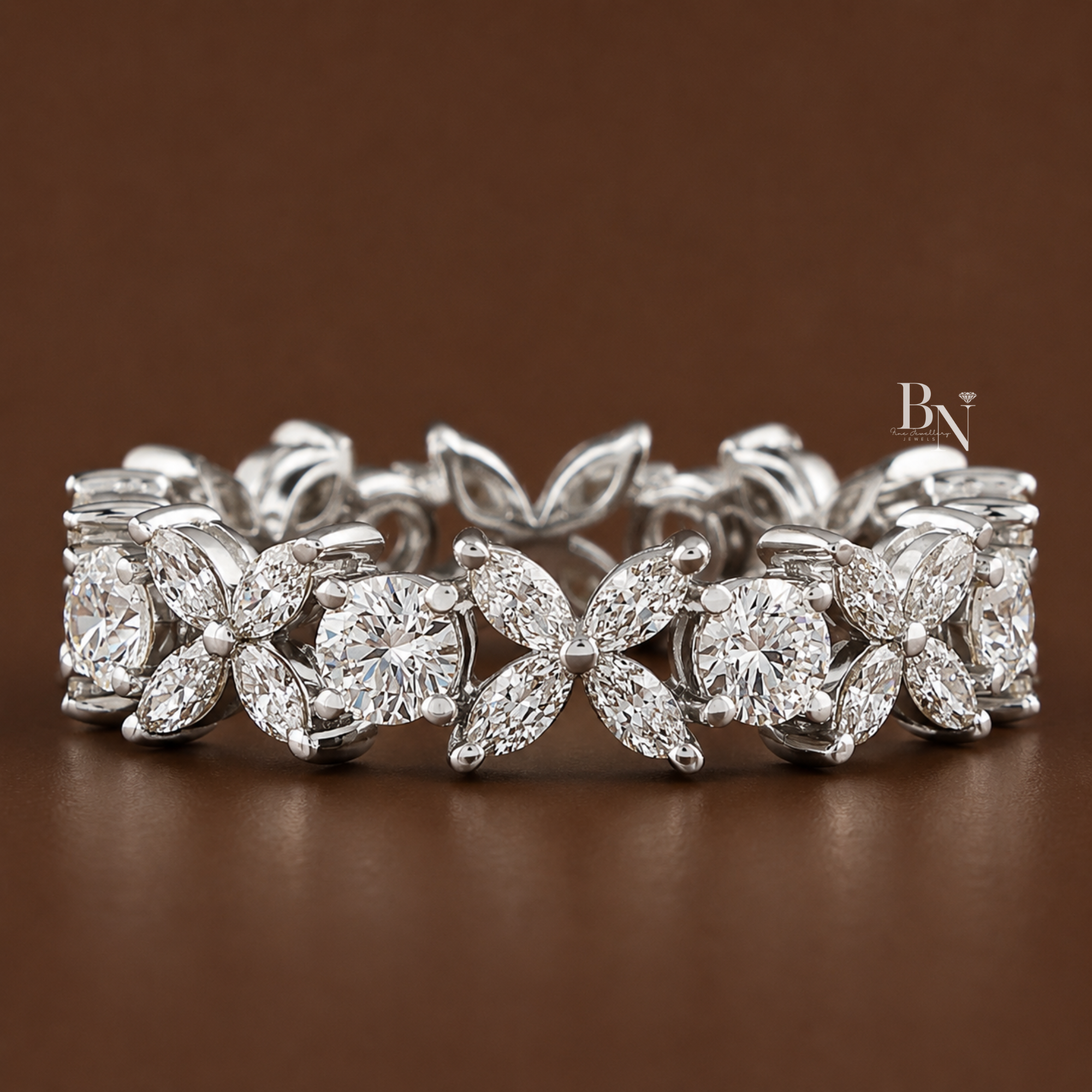 Alternating 1.55ctw marquise fleurette and round brilliant lab diamond eternity band crafted in 14K gold. This 5mm wide luxury wedding ring features a prong-set floral design with an intricate open gallery, perfect for an anniversary gift.