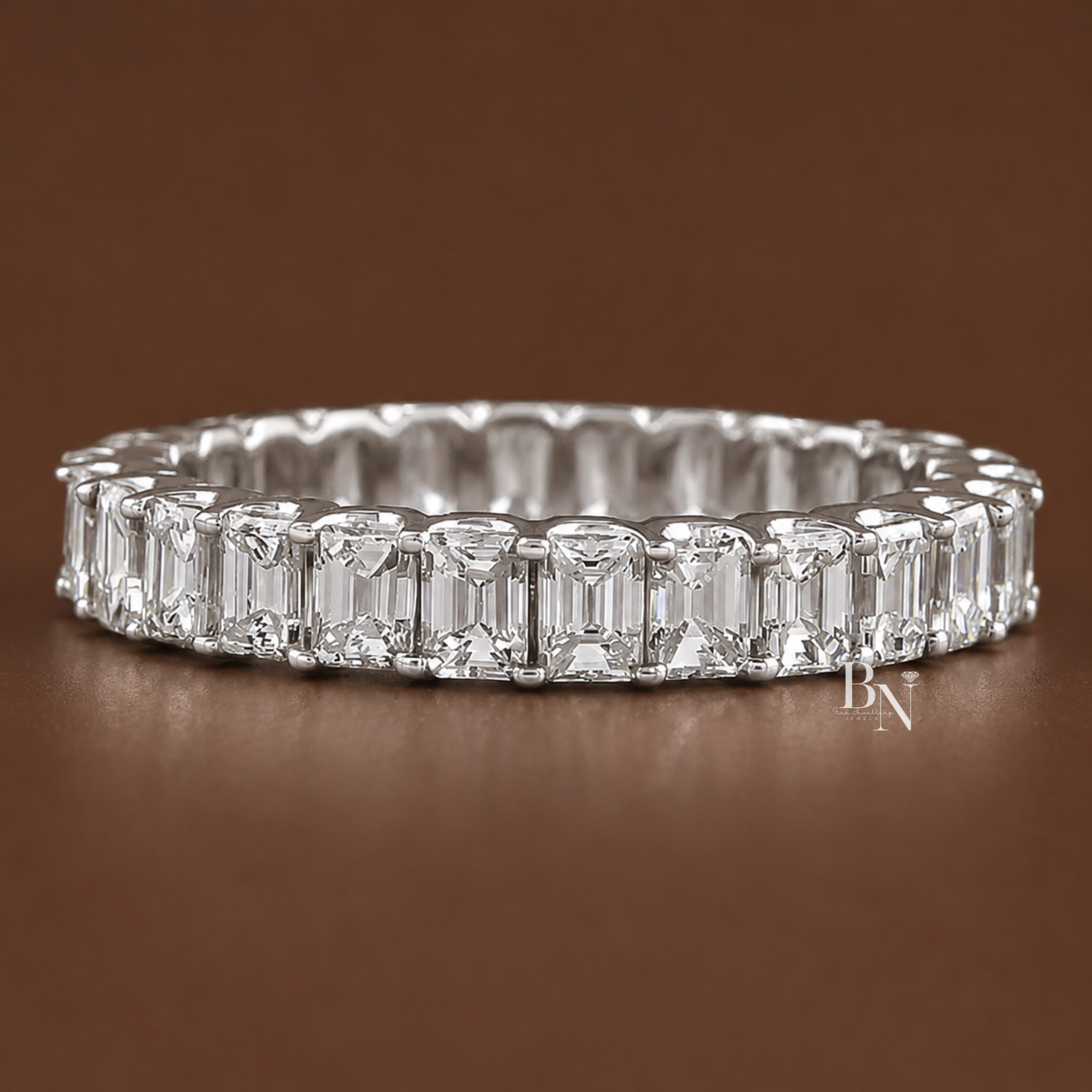 Brilliant 2.70ctw emerald cut lab diamond full eternity band in 14K gold. Features an open profile U-shape setting allowing maximum light, perfect as a luxury wedding band or anniversary stacking ring. Shown with exceptional step-cut clarity.