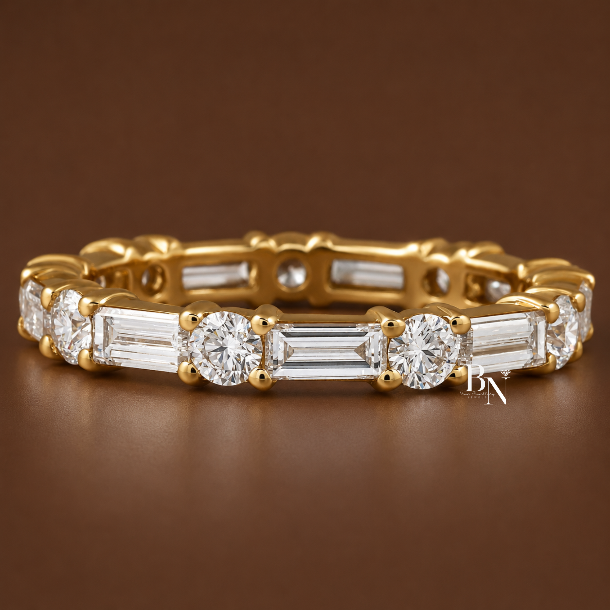 Alternating round brilliant and horizontal baguette cut lab diamond full eternity band. Featuring a delicate 3mm wide shared prong setting in solid gold, this 1.63 carat total weight luxury bridal stacking ring is displayed on-hand.