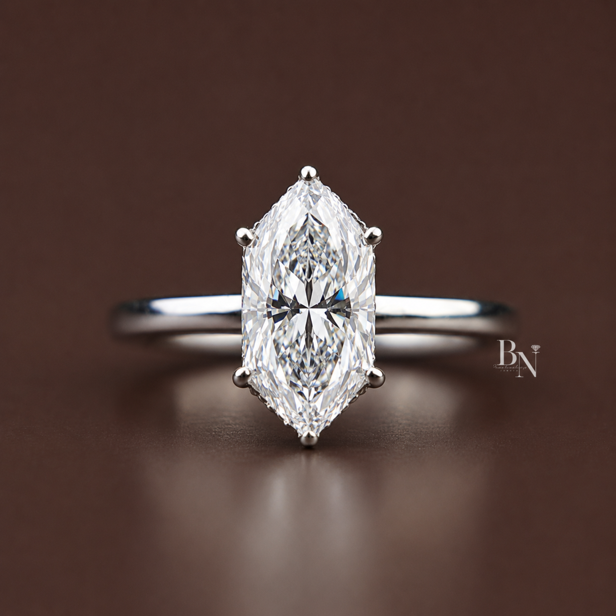 A sophisticated 1.5 carat Dutch marquise cut lab grown diamond solitaire engagement ring featuring a sleek, modern bezel setting on a delicate, hand-carved gold band with intricate vintage filigree side detailing.
