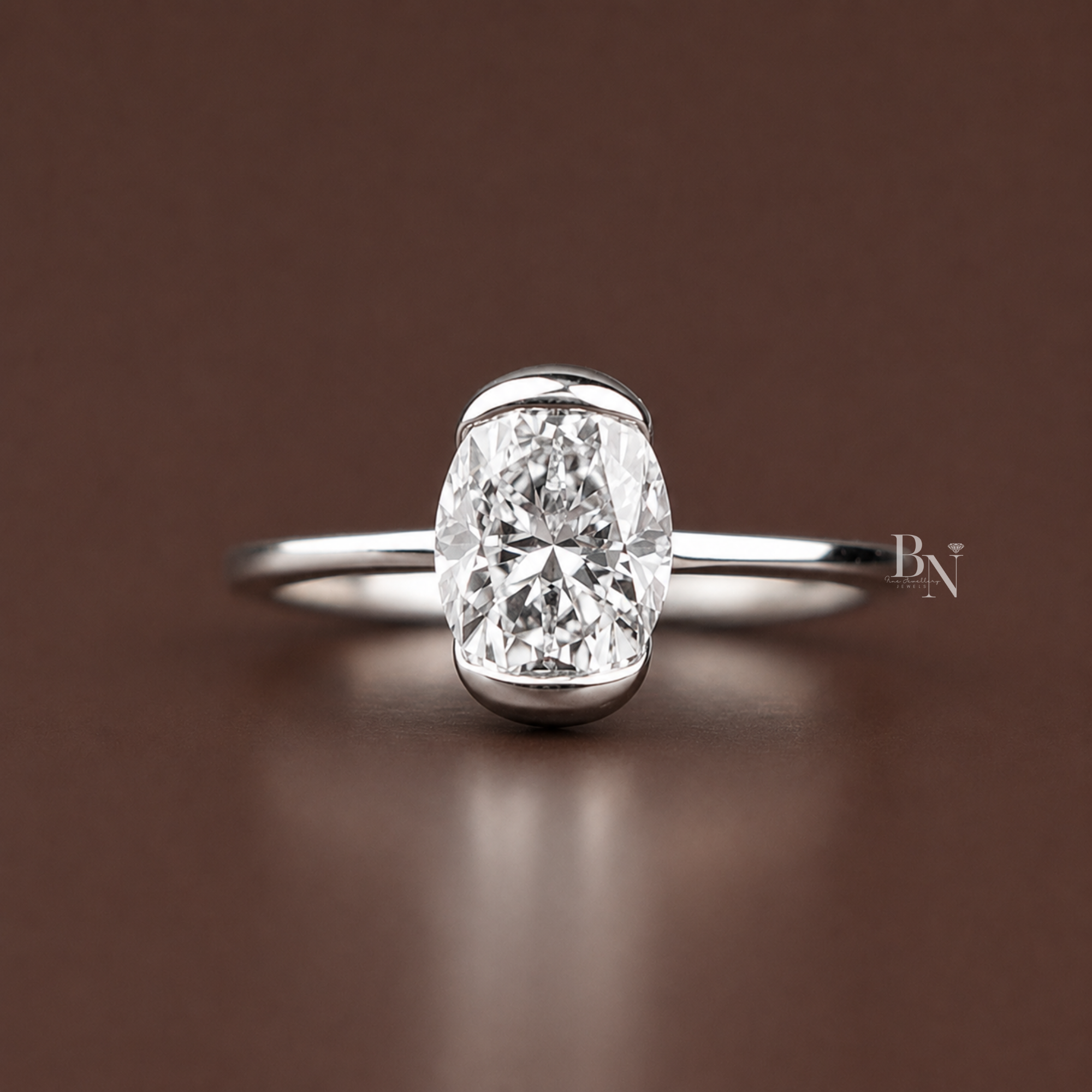 Oval cut lab diamond solitaire ring in half bezel setting, minimalist engagement ring with 1 carat appearance, handcrafted in high polish white gold band.