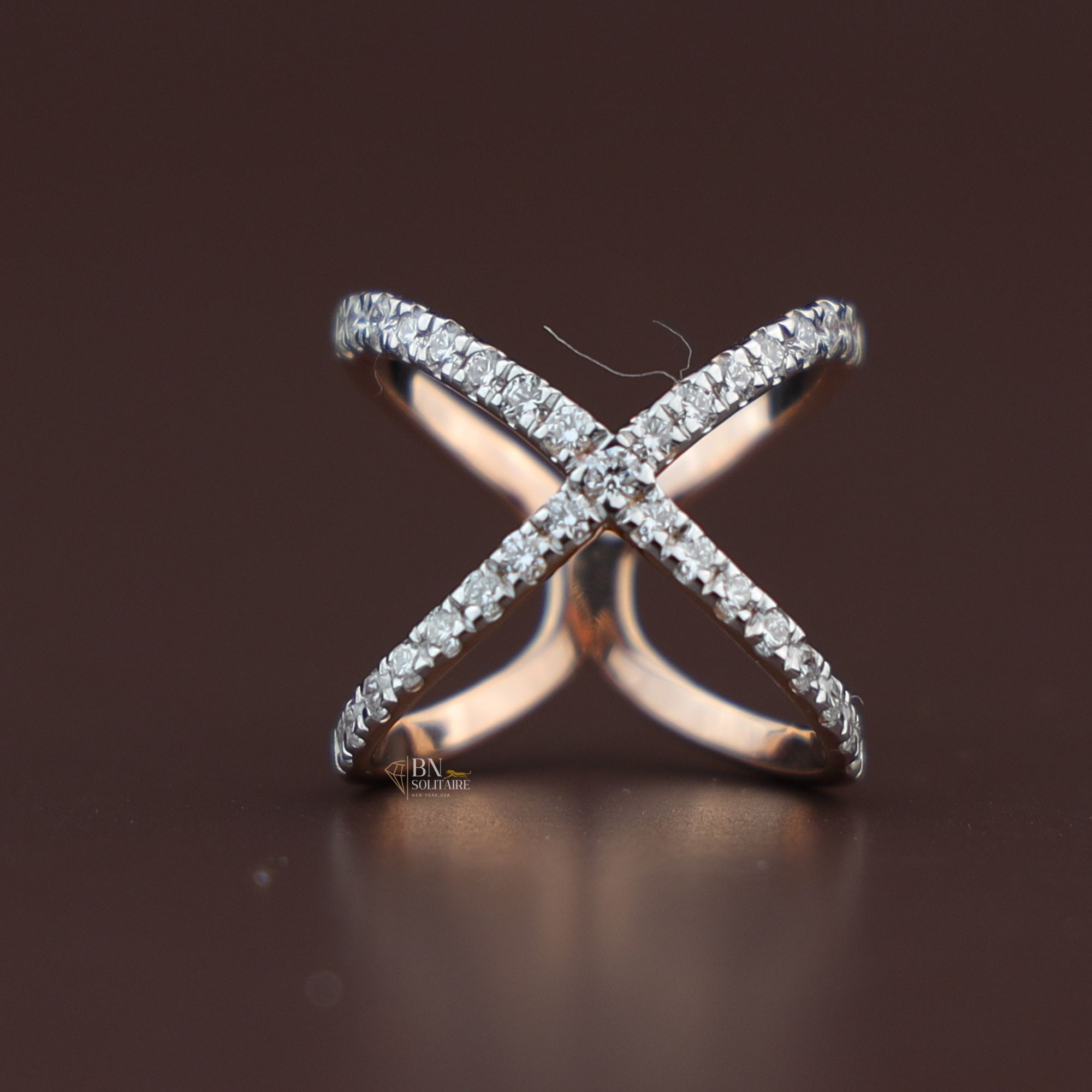 Crossover X-shaped band featuring pavé-set lab diamonds in a high-polish rose gold setting, modern statement ring perfect for stacking or bridal wear.