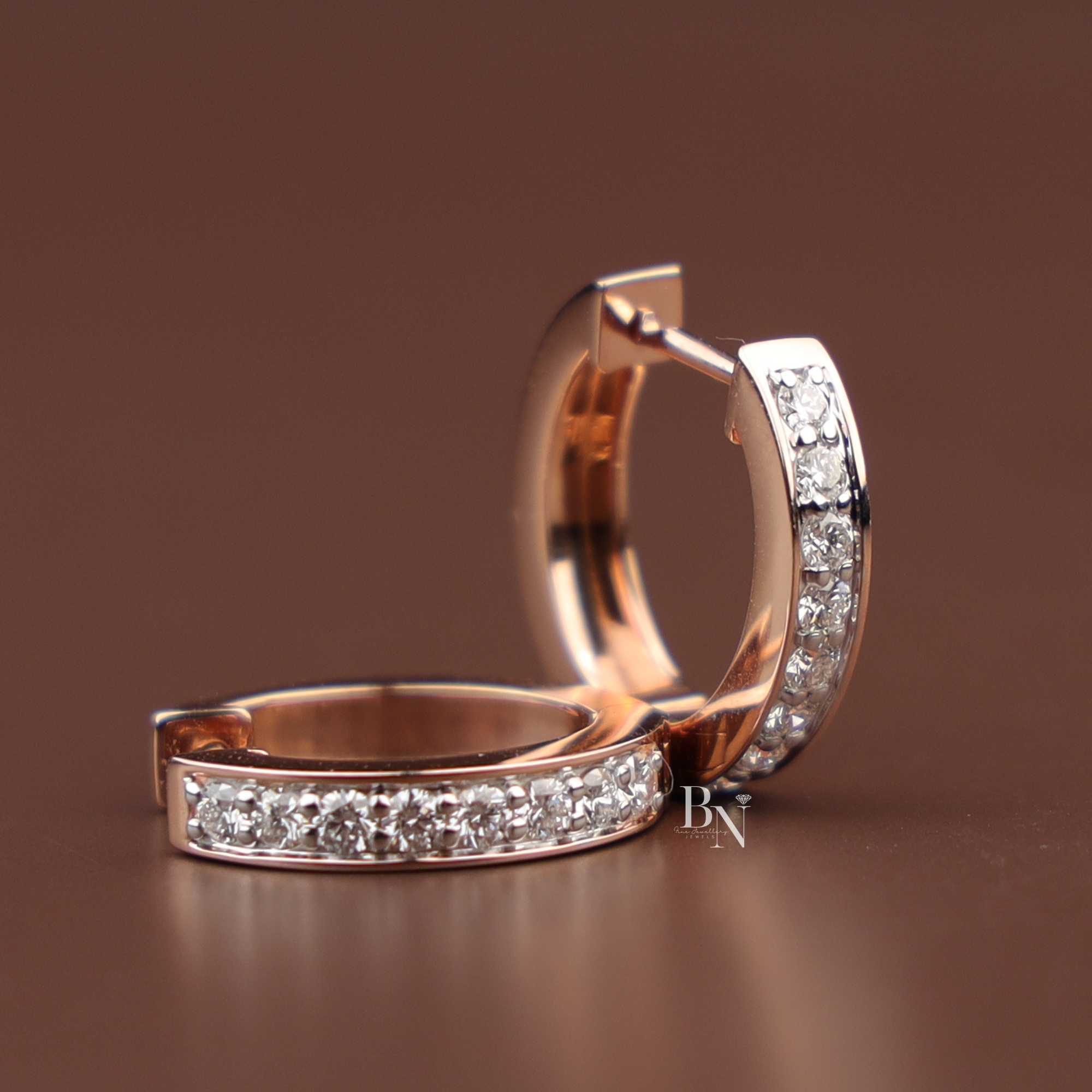 Pavé-set lab diamond huggie hoops in a polished gold channel setting, minimalist small hoop earrings, perfect for daily wear or elegant layering.