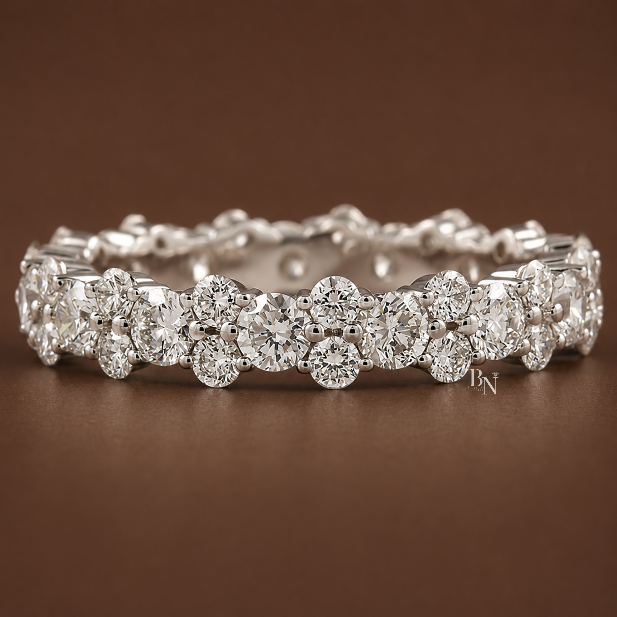 1.87 carat total weight round brilliant cut lab diamond full eternity band in solid gold. Featuring an alternating cluster design of one large and two small diamonds, this 3.9mm wide luxurious bridal stacking ring offers exceptional sparkle.