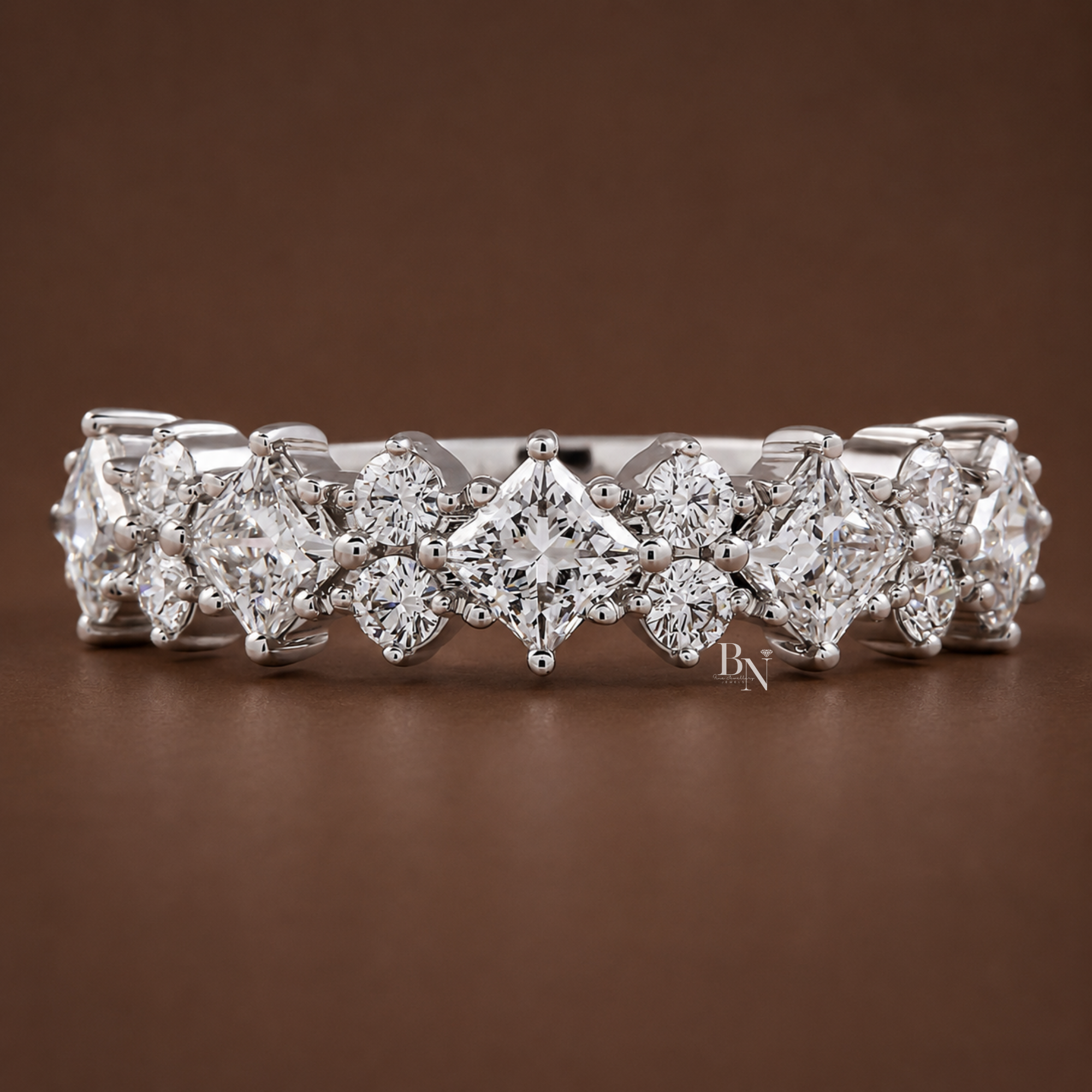 Front view of a white metal 5.3mm wedding band featuring an alternating pattern of compass-set princess-cut lab diamonds and stacked round stones halfway across the band.