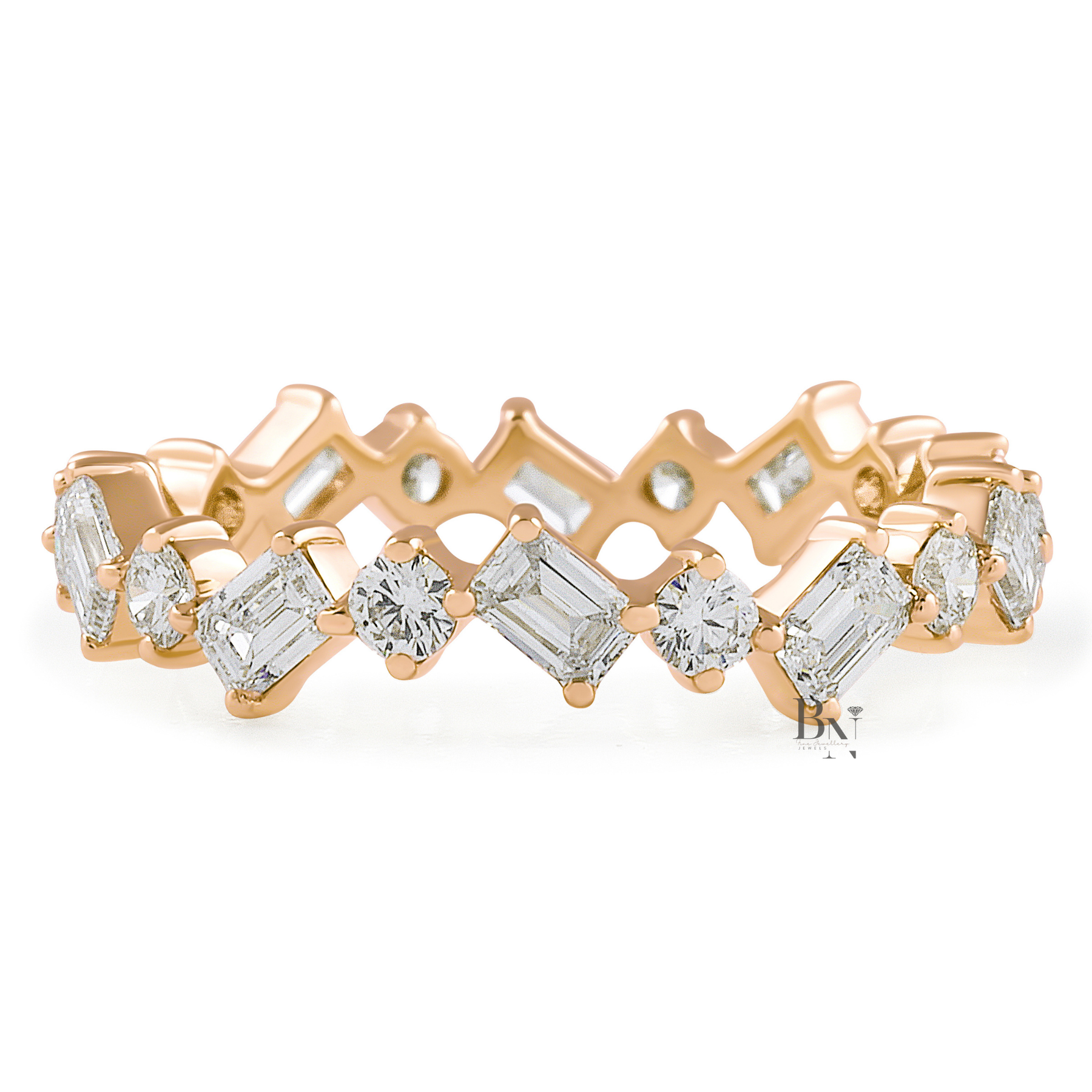 Angled view of a 14K yellow gold eternity band featuring a zig-zag pattern of alternating emerald-cut and round brilliant lab-grown diamonds.