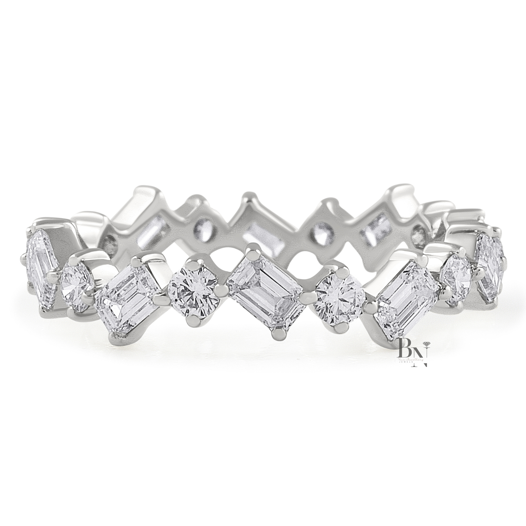 Angled view of a 14K yellow gold eternity band featuring a zig-zag pattern of alternating emerald-cut and round brilliant lab-grown diamonds.