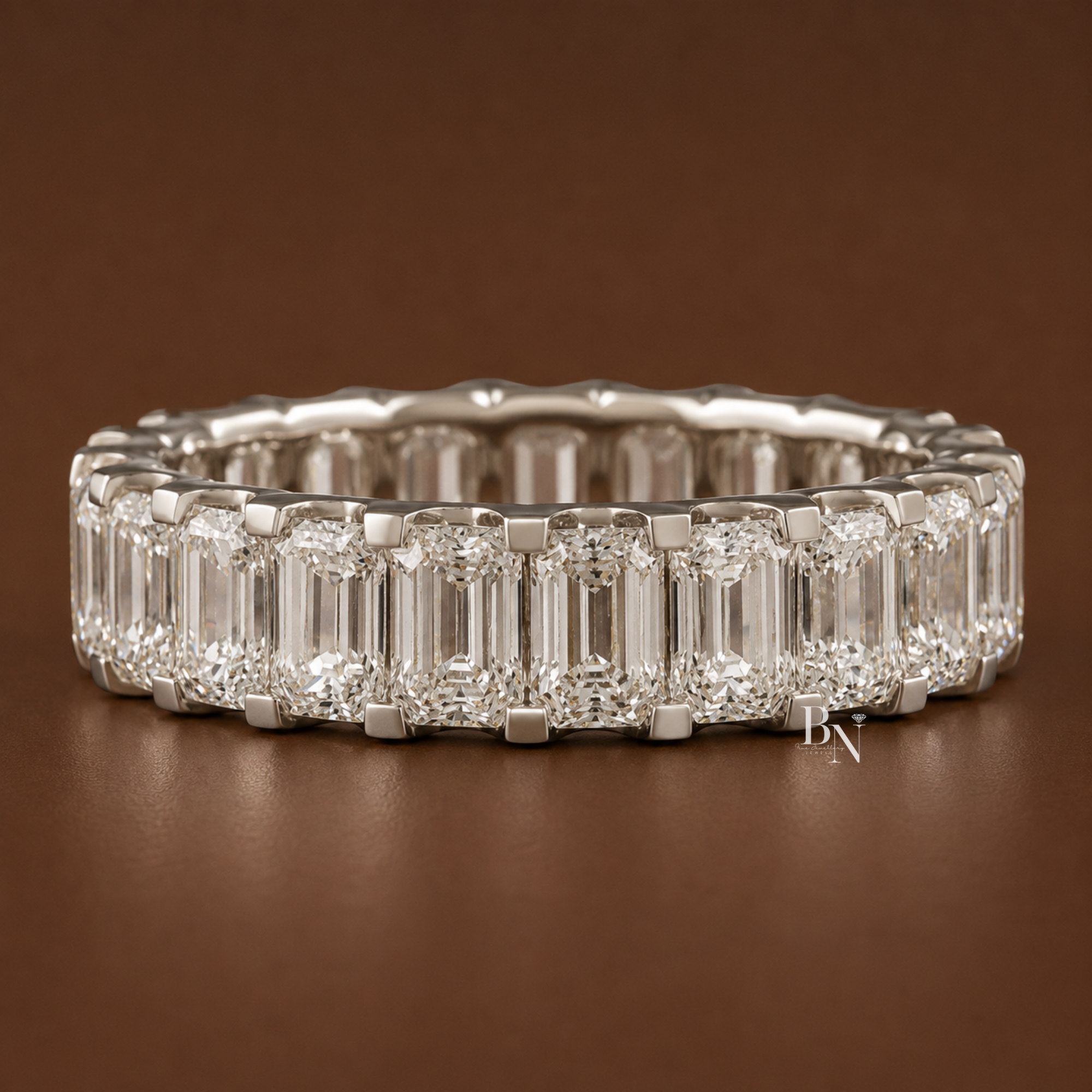 3.90 carat total weight emerald cut lab diamond full eternity band in a 14k solid gold U-shape setting. Measuring 5.5mm wide, this luxurious wedding and anniversary ring features perfectly matched 0.20ct stones showcasing brilliant craftsmanship.