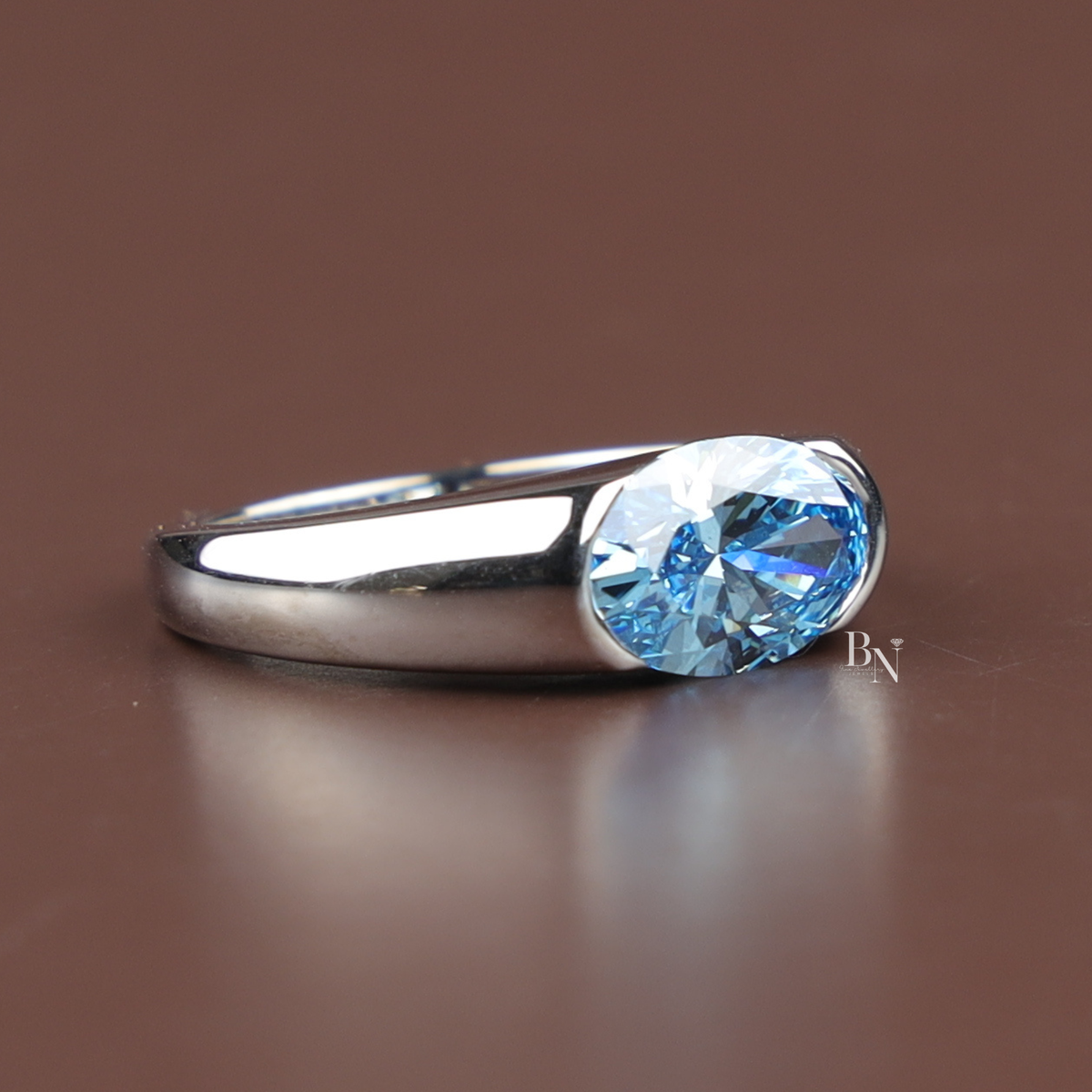 2.5ct Fancy Blue Oval Cut Lab Grown Diamond Ring, Bezel Set Modern Solitaire