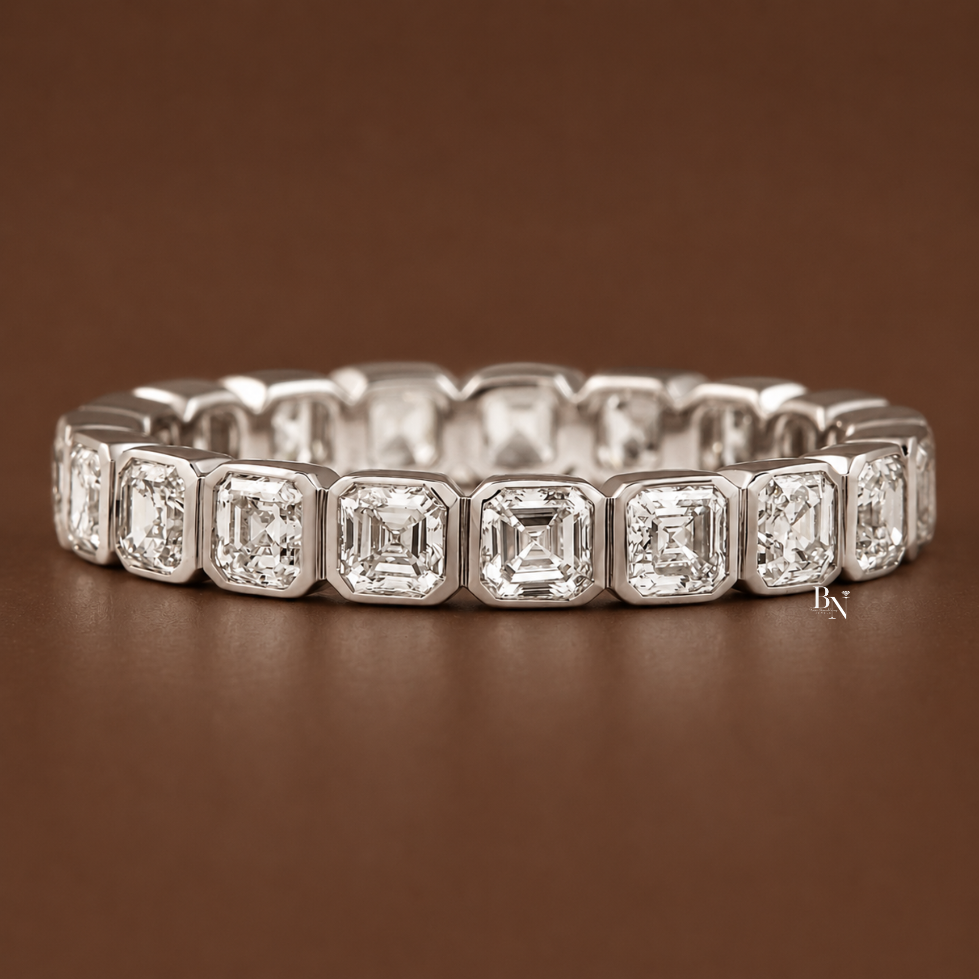 Angled front view of a white gold Asscher cut lab diamond full eternity band showcased on a warm brown background.