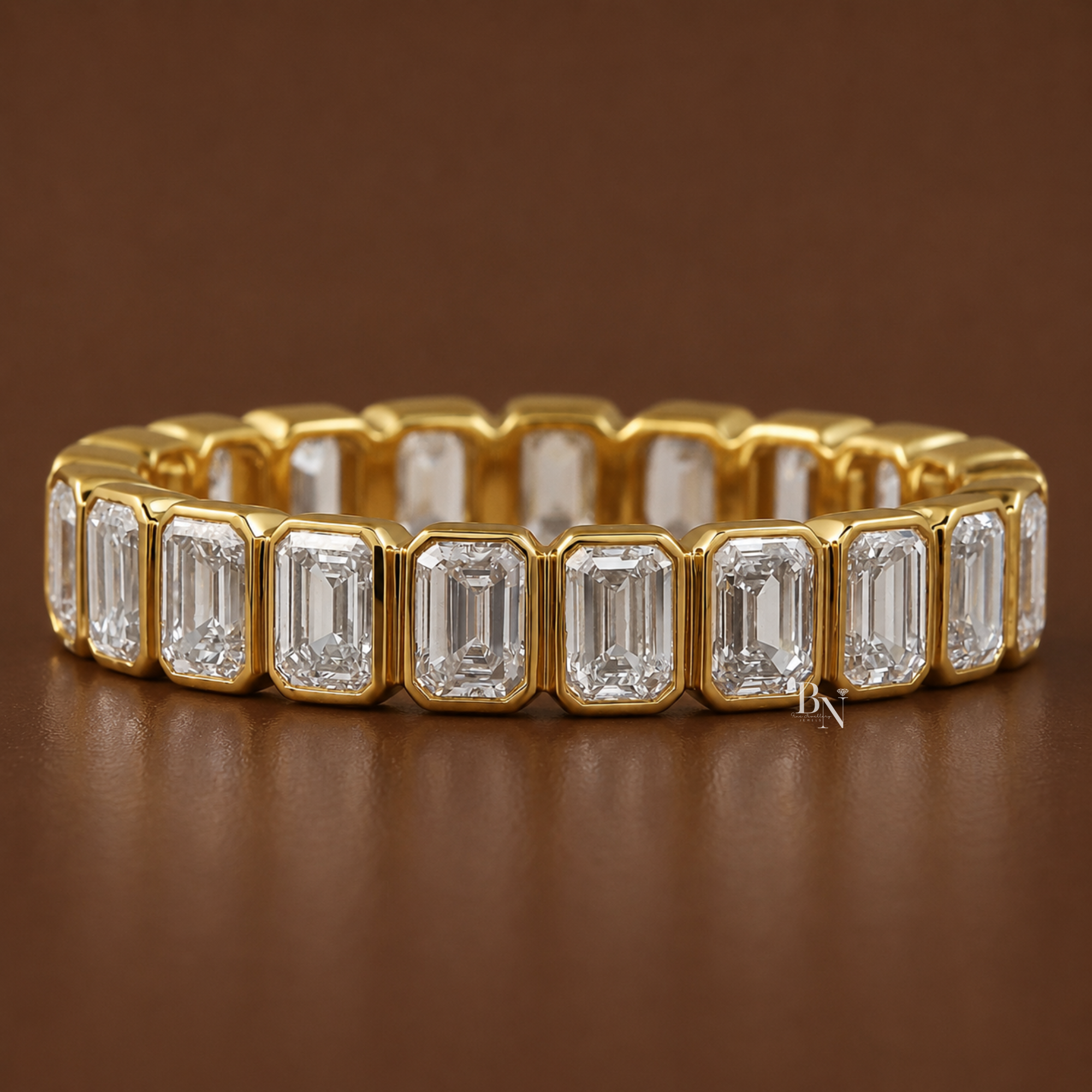 1.70 carat total weight emerald cut lab diamond full eternity band in a solid gold bezel setting. Showing a 4.1mm wide luxury wedding ring displaying perfectly matched step-cut stones wrapped entirely in precious metal.