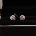 0.45 carat total weight round brilliant lab grown diamond halo stud earrings in 14k rose gold showing a floral cluster design with a sparkling micro-pave diamond halo and secure screw-back posts for fine jewelry gifting.