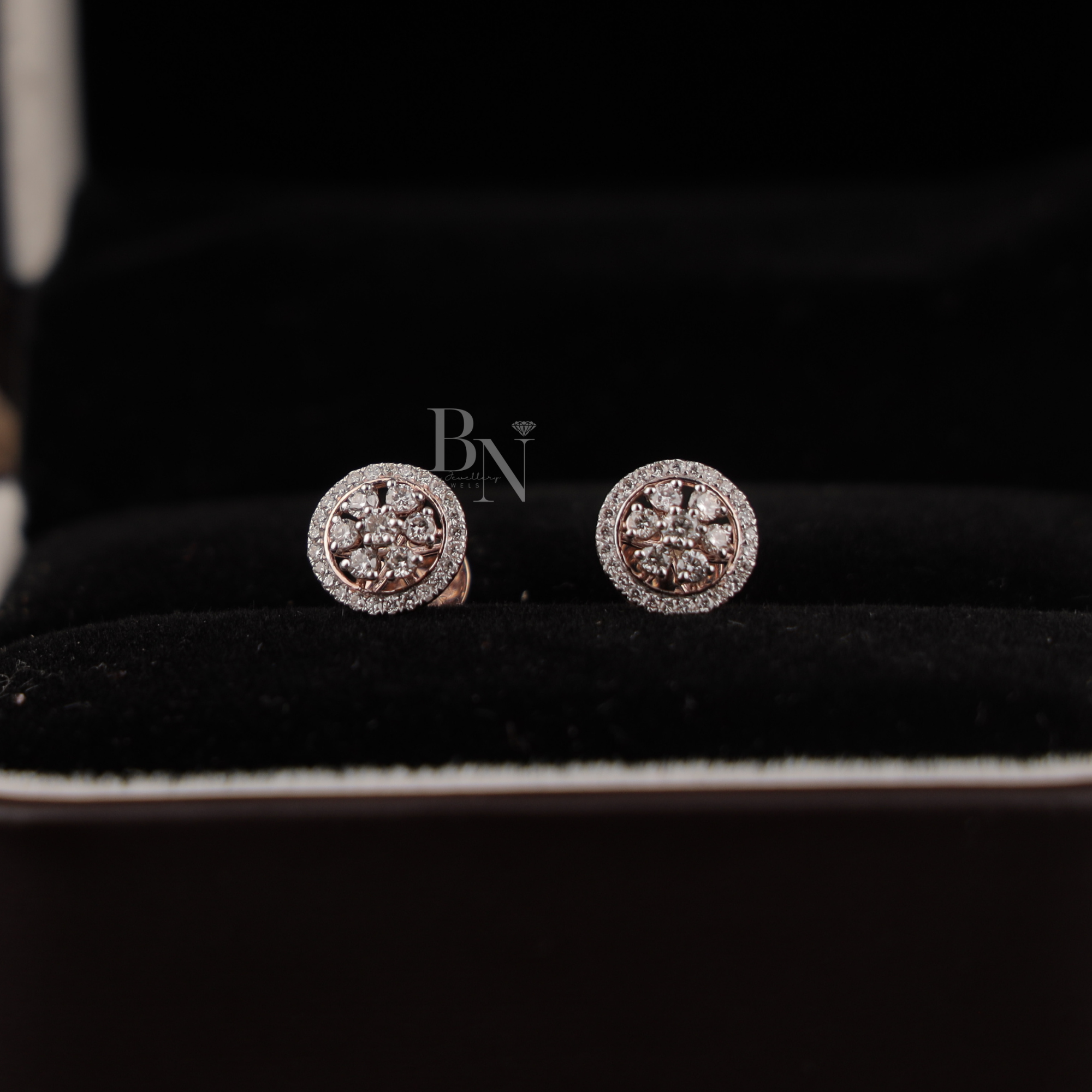 0.45 carat total weight round brilliant lab grown diamond halo stud earrings in 14k rose gold showing a floral cluster design with a sparkling micro-pave diamond halo and secure screw-back posts for fine jewelry gifting.