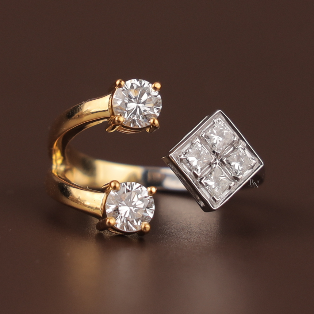 Dainty 14k two-tone gold bypass ring featuring a kite-set square princess cut lab diamond cluster and two round brilliant stones in a unique Toi et Moi engagement setting for a modern luxury bridal look.