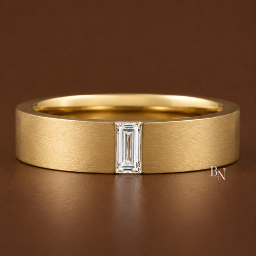 Front face-on view of a 14K yellow gold men's flat ring featuring a matte finish, high-polish edges, and a single vertical baguette lab-grown diamond in a flush setting.