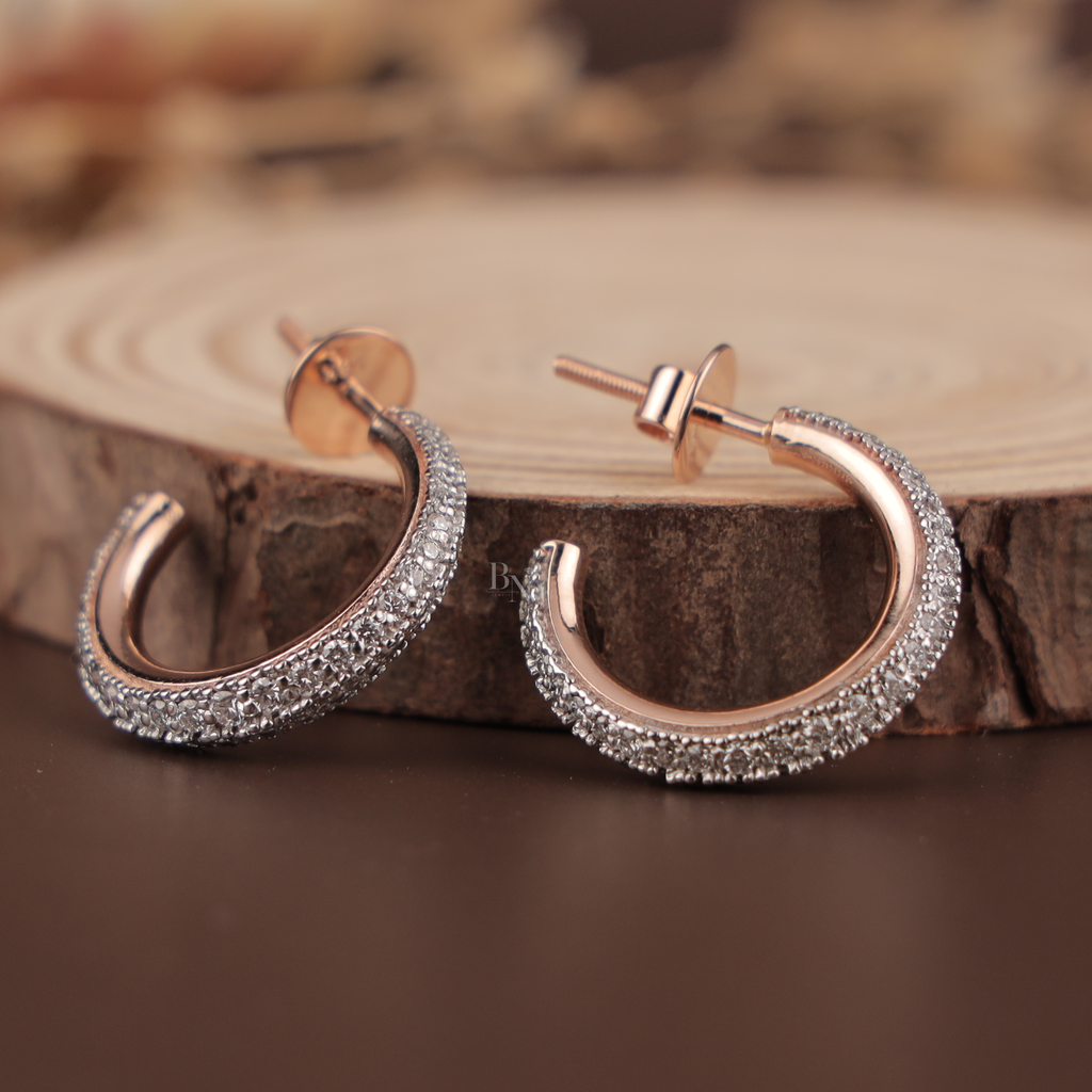 Dainty 14k rose gold C-hoop earrings featuring three rows of micro pave lab grown diamonds with secure threaded screw back posts to prevent loss, showing brilliant white light scintillation and Type IIa clarity on a dark background.