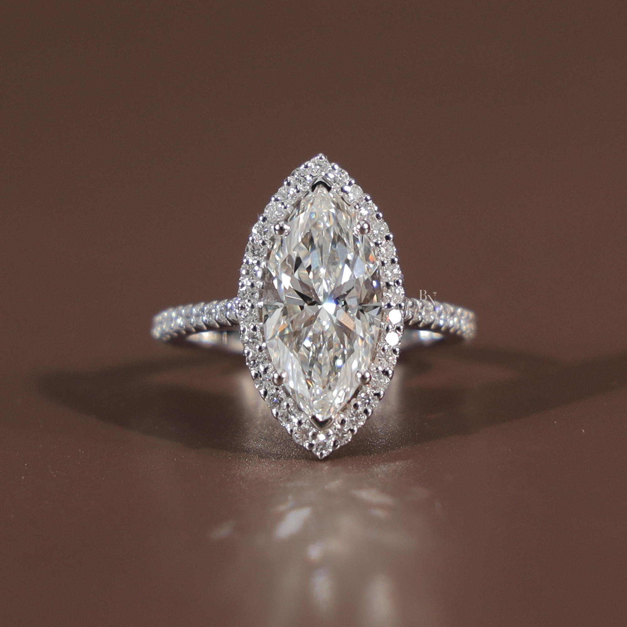 3 carat marquise cut lab grown diamond engagement ring in 14k white gold featuring a brilliant diamond halo and a slim pave encrusted band showing high-set cathedral profile and icy white Type IIa clarity.