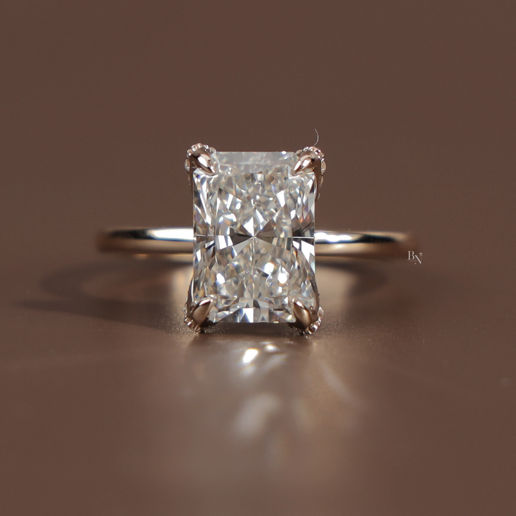 Profile view of a 3.5 carat radiant cut lab grown diamond engagement ring in 14k yellow gold featuring a sparkling hidden halo pave bridge and a delicate diamond encrusted band showcasing exceptional Type IIa clarity and icy white brilliance.