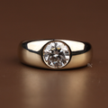 1.50 carat round brilliant cut lab grown diamond engagement ring in a secure bezel setting with a thick 14k yellow gold wide band showing high polish finish and modern minimalist design for a timeless proposal.