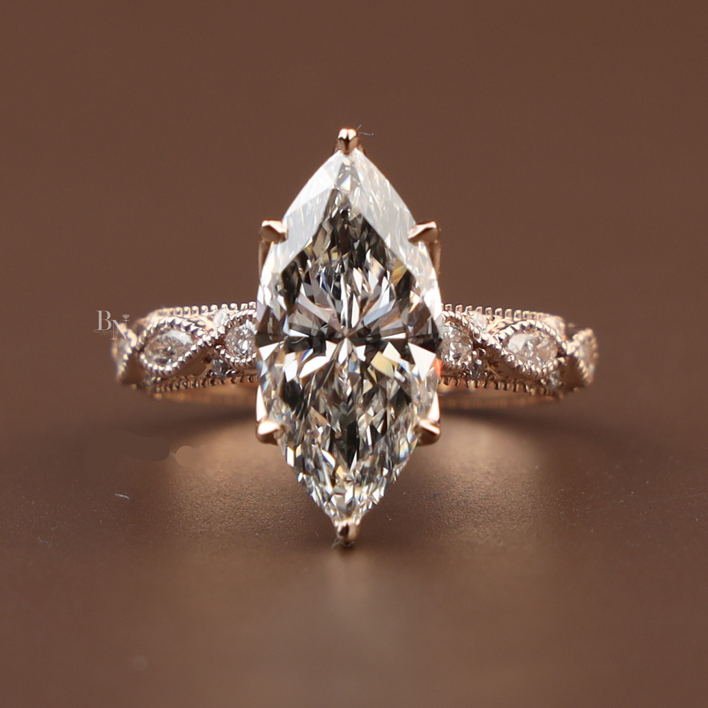 3 carat marquise cut lab grown diamond engagement ring with twisted vine rose gold band featuring intricate milgrain detailing and sparkling side stones.