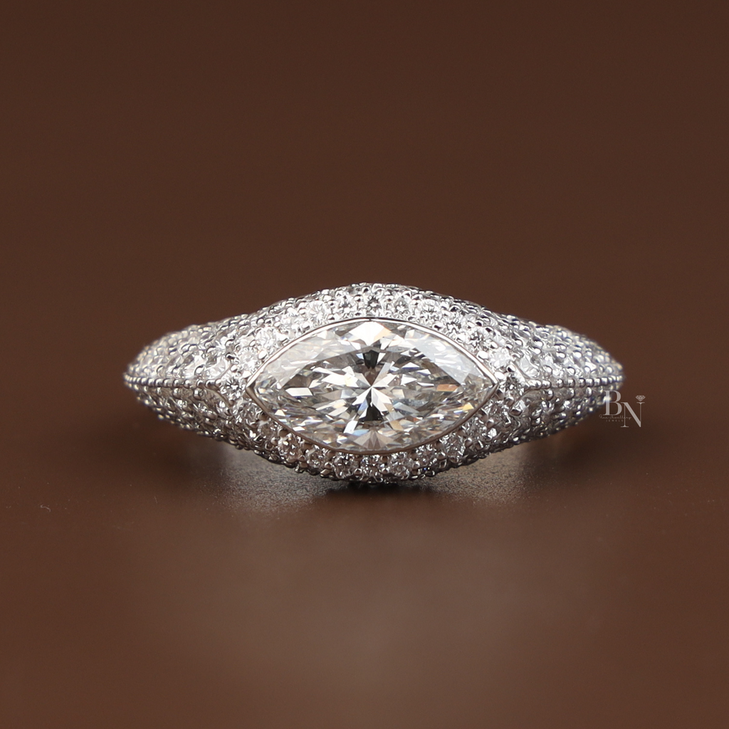 2 carat marquise cut lab grown diamond engagement ring in 14k white gold featuring a shimmering hidden halo and tapered pave diamond band with a high profile cathedral setting and pave bridge detail.