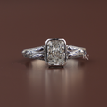 A 1.50 carat radiant cut lab grown diamond solitaire engagement ring in a vintage-inspired platinum bezel setting featuring intricate hand-engraved scrollwork along the band viewed from multiple side and top profile angles.