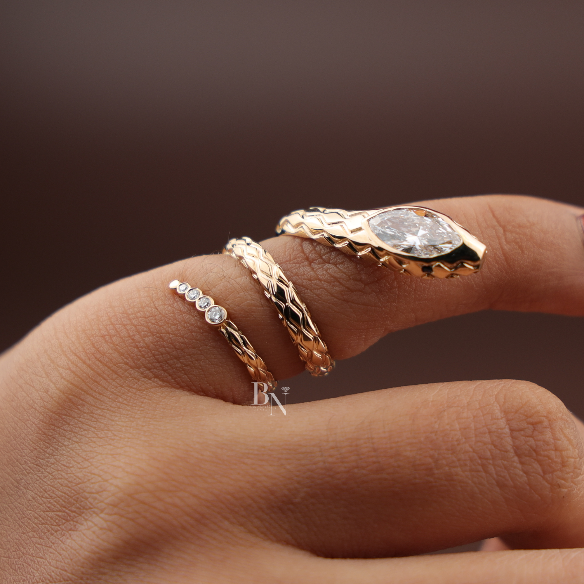 One carat marquise cut lab grown diamond snake wrap ring in 14k yellow gold featuring textured scale detailing and a round diamond accent tail viewed from multiple angles in Untitled design (97)_16.jpg and related files.