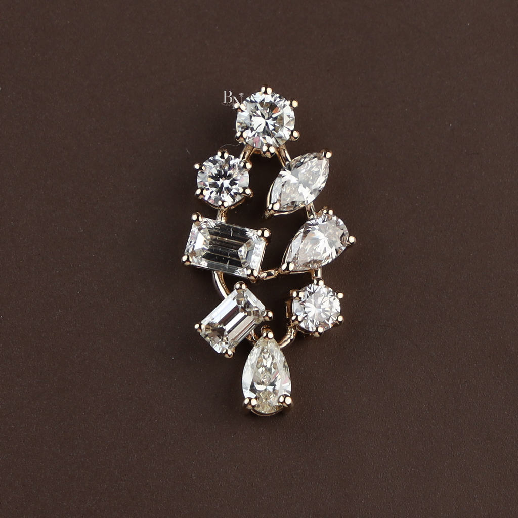 Macro view of 2.50 carat lab grown diamond mixed cut cluster pendant in 14k yellow gold featuring round brilliant, pear, emerald, and marquise diamonds on a gold chain for a high-end luxury bridal or anniversary jewelry gift.