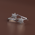 An elegant white gold open bypass ring featuring two sparkling round lab grown diamond star clusters on a delicate polished shank, viewed from multiple angles on a display and a hand.
