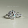 Close-up of 1 carat round brilliant cut lab grown diamond halo engagement ring in 14k white gold. Halo setting and pave band maximize stone size and crisp white light scintillation for Google Images.