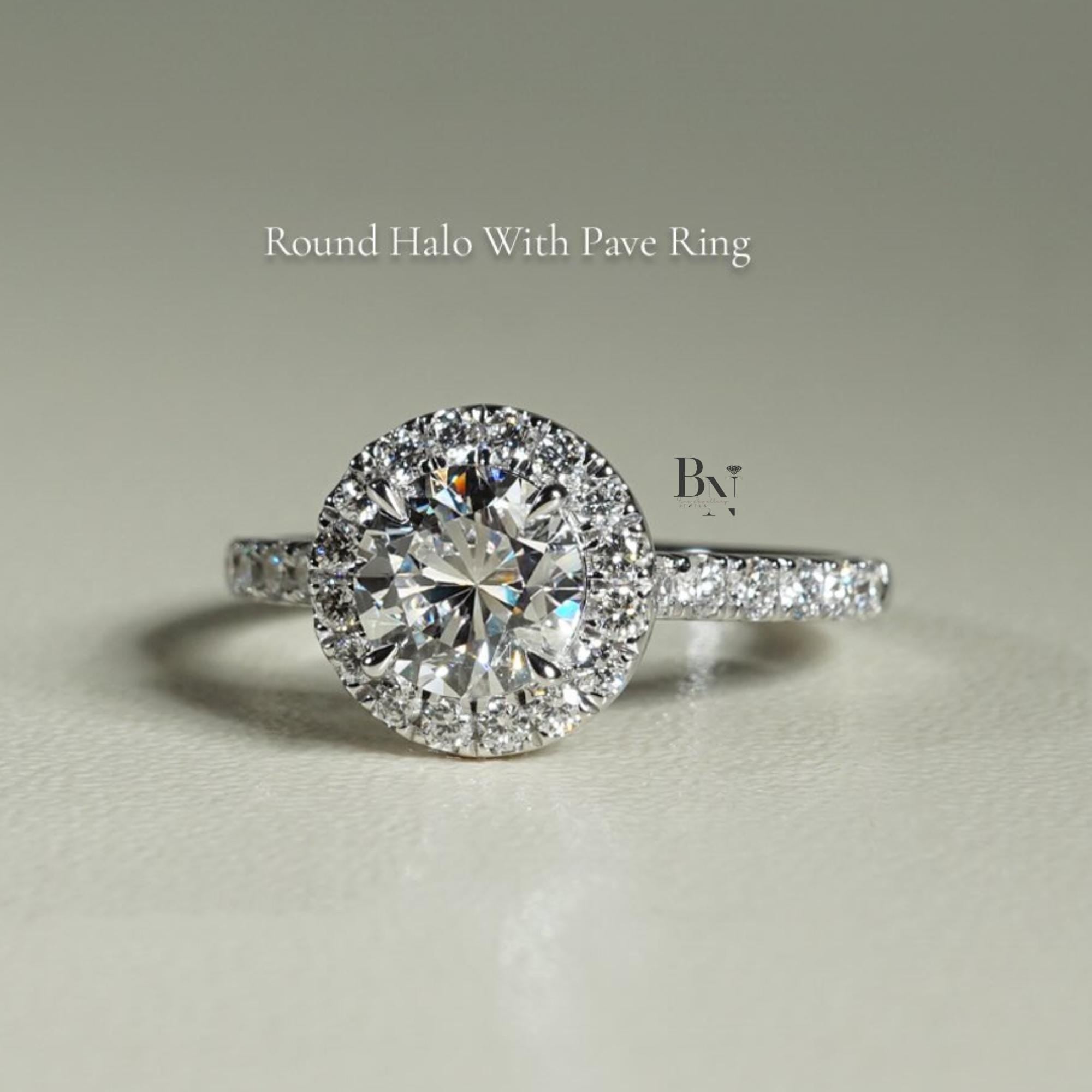 Close-up of 1 carat round brilliant cut lab grown diamond halo engagement ring in 14k white gold. Halo setting and pave band maximize stone size and crisp white light scintillation for Google Images.
